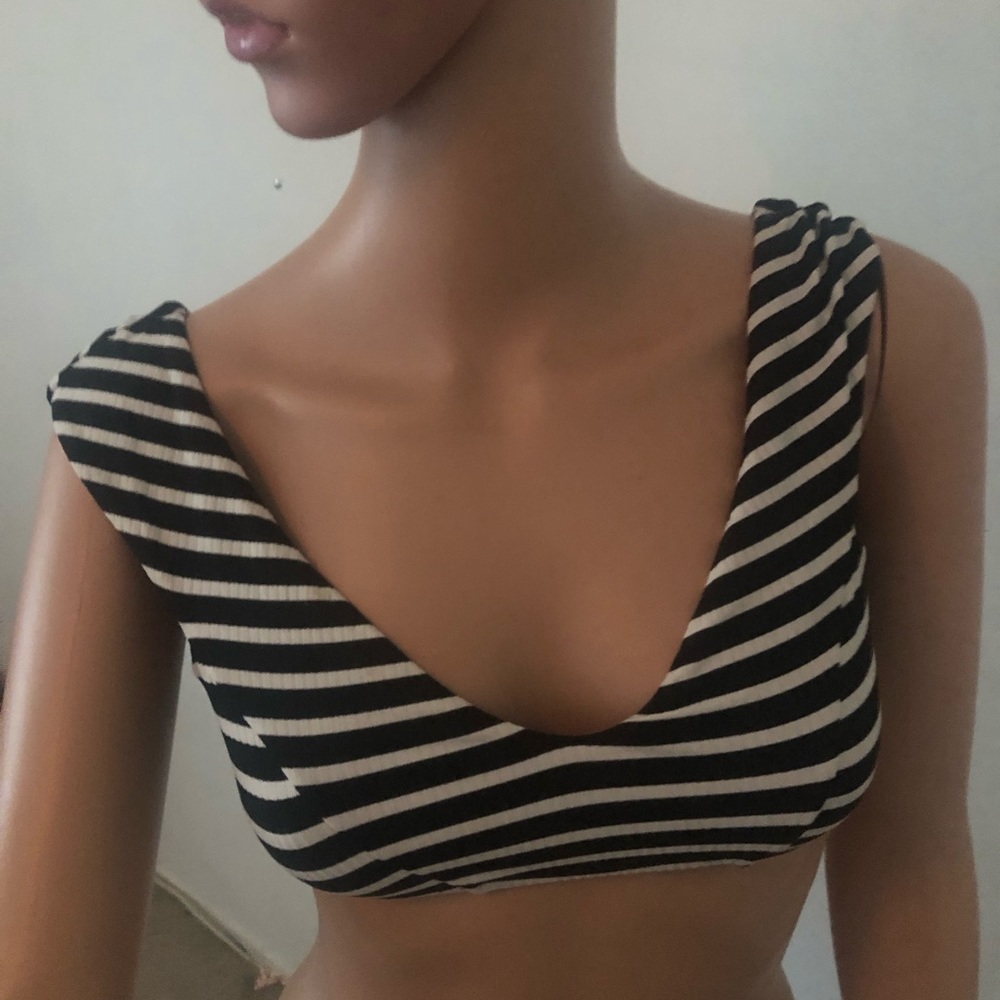 Vitamin A size medium. Striped black and white swim top